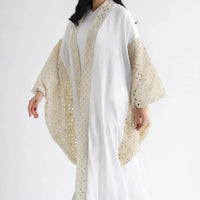 Kaftan en lin brodé et drapé