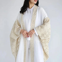 Kaftan en lin brodé et drapé